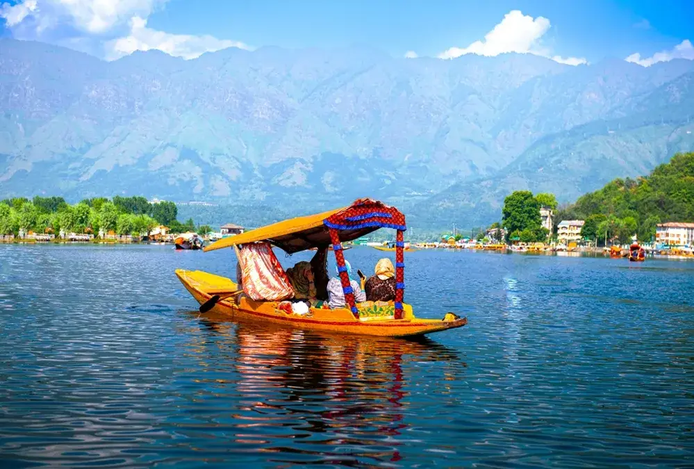 kashmir tour packages bangladesh offer peaceful shikara boat rides on dal lake amid himalayan beauty