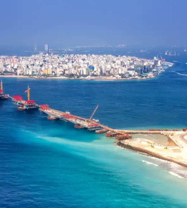 Aerial view of Malé city and connecting bridge, showcasing the urban beauty included in Maldives tour packages from Bangladesh