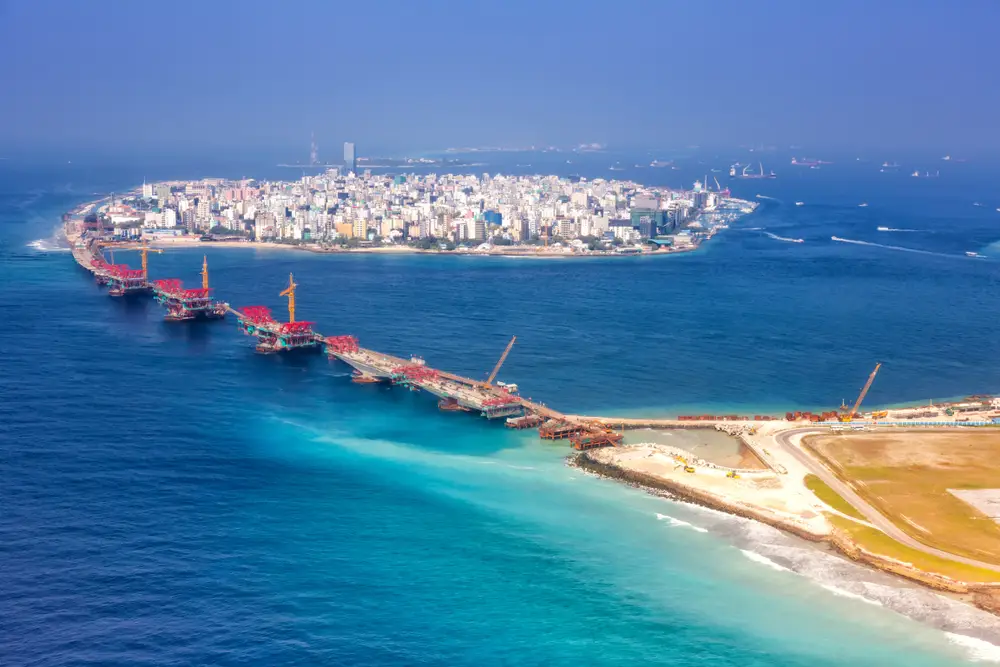 Aerial view of Malé city and connecting bridge, showcasing the urban beauty included in Maldives tour packages from Bangladesh