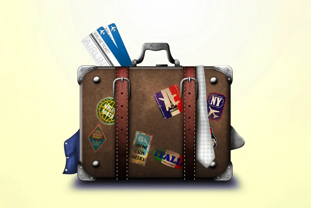 A classic suitcase with travel stickers and tickets, symbolizing memorable global adventures arranged by your trusted Tour and Travel Agency in Bangladesh